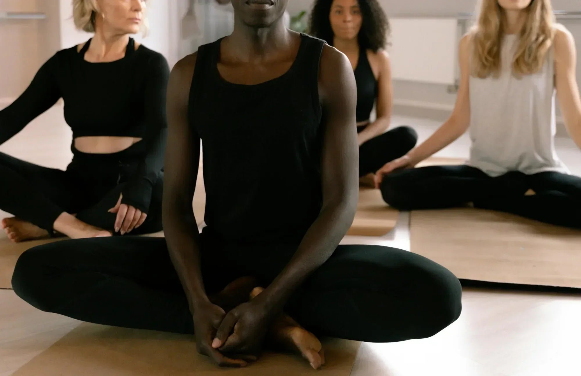 Group of people practicing mindfulness and meditation, symbolizing the connection between gut health and brain function