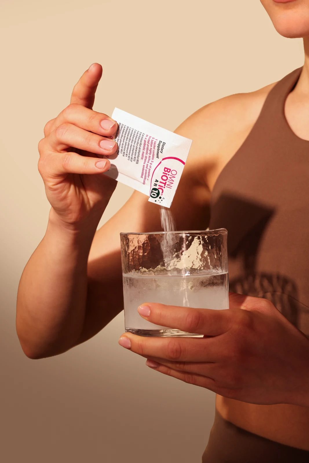 Preparing Omni-Biotic in a glass of water
